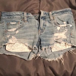 Distressed stretch jean shorts